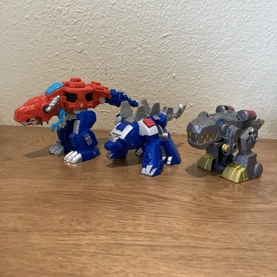 Transformers Rescue Bots OPTIMUS PRIME Dino Bot T-Rex, Stegosaurus, GRIMLOCK - Image 1 of 3