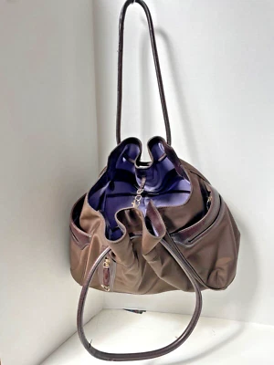 Bolso TUMI de nailon balístico con cordón de cuero 13" (marrón oscuro con púrpura) Foto 1 de 4