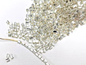 20gms Toho size 11/0 Triangle Beads - Colour TG- 21 - Crystal Clear Silver Lined - Picture 1 of 5