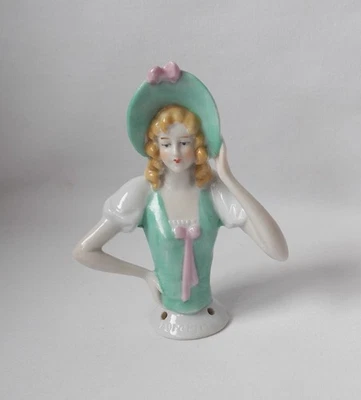 VINTAGE PORCELAIN PIN CUSHION HALF DOLL ARMS APART HAT WITH BOW 3.5" HIGH - Image 1 of 4