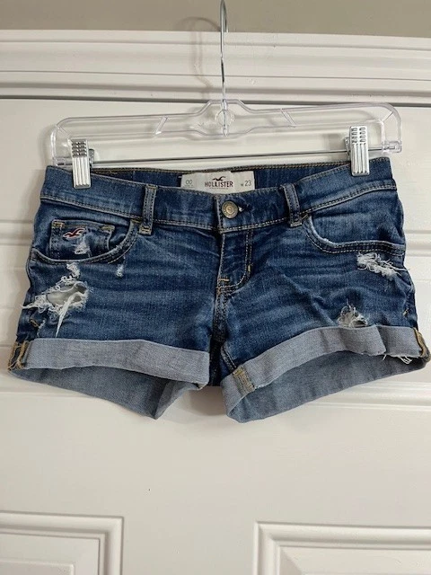 Mini micro pantalones cortos de mezclilla Hollister lavado medio Y2k tiro bajo dobladillo con puños talla 00/23 Foto 1 de 4