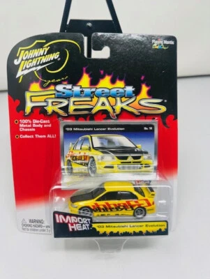 *NEW* Johnny Lightning Street Freaks '03 Mitsubishi Lancer Evolution (Yellow) - Image 1 of 4