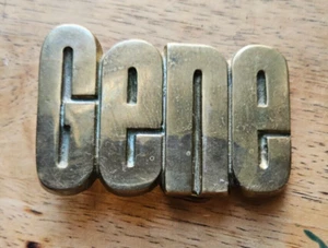 "GENE" BRASS BELT BUCKLE. 1978 BARON BUCKLE. SOLID BRASS - Picture 1 of 6