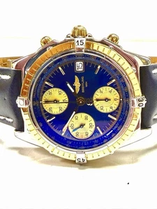 Breitling Chronomat, Gold/Stahl mit Lederband, blaues Zifferblatt, Box + Papiere - Bild 1 von 14