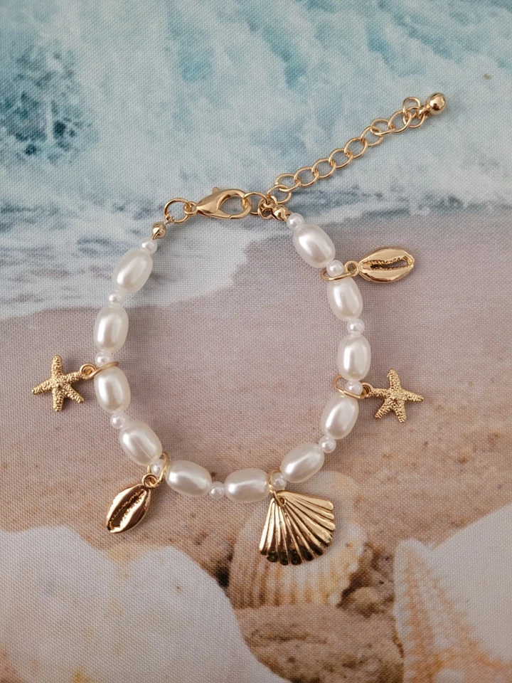 Mediterranes Perlenarmband gold mit Muschel Charms 18- 23cm / 1410 - Bild 1 von 1