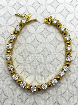 Pulsera mini punk redondeada nOir Joyería tono dorado cristal transparente Foto 1 de 4