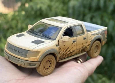 Camioneta 5" Kinsmart Ford F-150 SVT Raptor SuperCrew 1:46 Diecast Muddy White Trk Foto 1 de 4