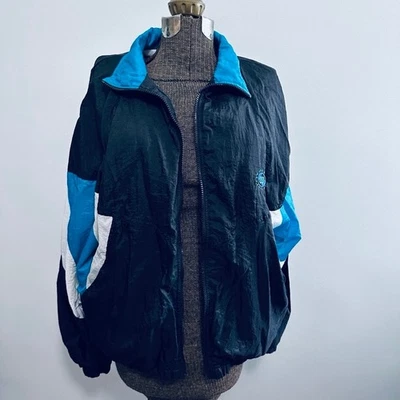 Cortavientos Wilson vintage años 90 verde azulado y negro Foto 1 de 4