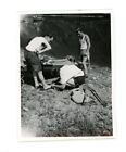 Men camping , man attending to another's foot  Vintage snapshot Photo