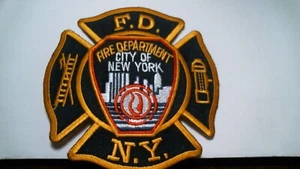 New York Fire Department (FDNY) - TOPPA ANTINCENDIO CROCE MALTESE NERA - VINTAGE - Foto 1 di 2