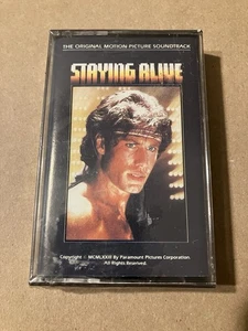 STAYING ALIVE - Cassette Sealed Soundtrack Bee Gees Travolta 1983 - Picture 1 of 4