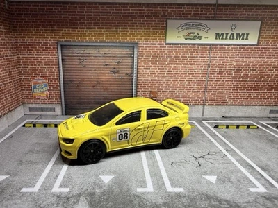 Coche Mattel de carreras amarillo polifonía Hot Wheels Mitsubishi Lancer Evo 2006 #08 Foto 1 de 4