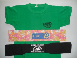 CAMISETA Y BRAZALETE/BANDAS PARA LA CABEZA DE LA ERA 1969-1970 de Woodstock__veterans for Peace - Imagen 1 de 2