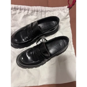 ALEXANDER MCQUEEN Glossed-leather exaggerated-sole loafers - Picture 1 of 3