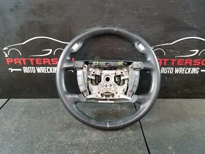 BMW 750 2007 volante envuelto en cuero negro con controles de accesorios Foto 1 de 4