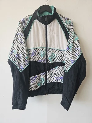 Chaqueta cortavientos Reebok vintage para hombre grande retro años 90 negra blanca púrpura turquesa Foto 1 de 4