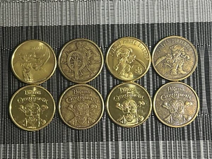 DISNEY WORLD PIRATES OF THE CARIBBEAN SET OF 4 2024 GOLD/BRONZE MEDALLION COINS - Picture 1 of 1