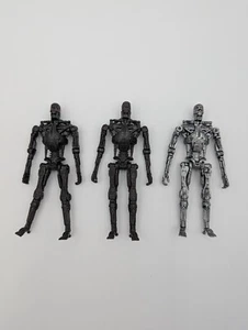 2009 TAAC Terminator Lot of Three - One T-800, Two T-700 Endoskeletons - 4 inch - Picture 1 of 24