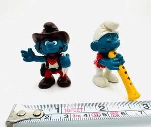Dos Figuras Pitufos Juguete Schleich Peyo Flautista Flauta y Vaquero De Colección 1978 1981 - Imagen 1 de 10