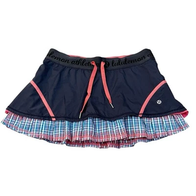 Falda corta de tenis Lululemon Run Resolution talla 8 capas a cuadros acampanada azul marino rosa Foto 1 de 4