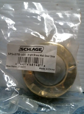 Tope de puerta de pared de latón brillante Schlage (SPS407B-605) FS Foto 1 de 3