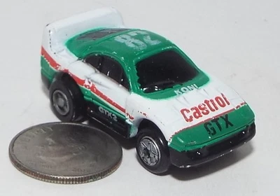 Pequeño micro máquina coche de carreras F-40 verde y blanco # 82 (a presión hacia atrás) un juguete de tracción hacia atrás Foto 1 de 4