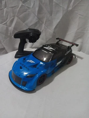 New Bright RC  1:14 Scale 4 Wheel Drive Nissan Forza~ Tested Works Great~ - Image 1 of 4