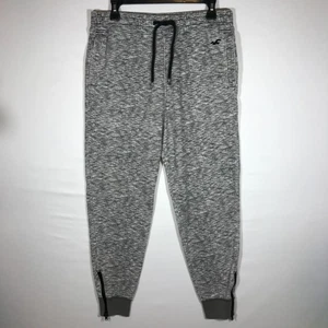 Pantalones deportivos Hollister pequeños gris jaspeado con cremallera al tobillo para hombre - Imagen 1 de 10