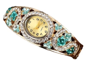 Gold Armreif Uhr Ovales Zifferblatt Kristall Lünette Kristall Akzente Blaugrün Metall Blumen - Bild 1 von 1