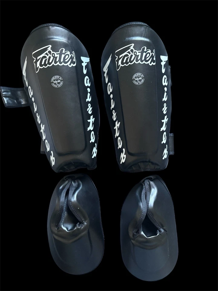 FAIRTEX SP7 ESPINILLERAS RETORCIDAS NEGRAS MUAY THAI KICK BOXING MMA K1 SEGURIDAD Foto 1 de 2