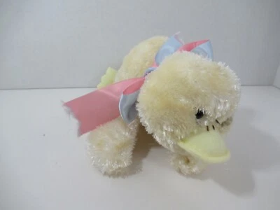cream or pale yellow plush duck laying lying down pink green bow - Image 1 of 4