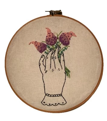 Handmade Embroidery Hoop Art – Vintage-Style Hand Holding Purple Flowers – 20cm - Image 1 of 4