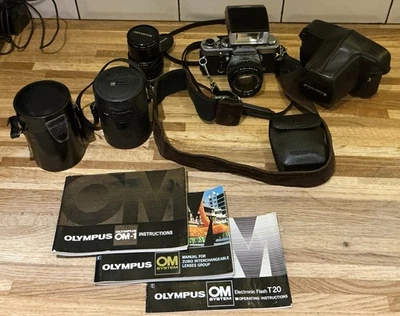 Olympus OM-1 MD SLR camera plus 3 Lenses And flash - Image 1 of 4