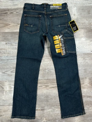 NUEVO CON ETIQUETAS Ariat Rebar M4 2X Pantalones de mezclilla duraderos tiro bajo corte bota para hombre 32x32 ropa de trabajo Foto 1 de 4