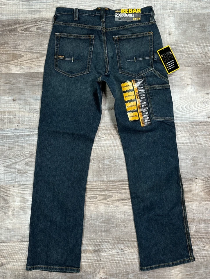 NUEVO CON ETIQUETAS Ariat Rebar M4 2X Pantalones de mezclilla duraderos tiro bajo corte bota para hombre 32x32 ropa de trabajo Foto 1 de 4