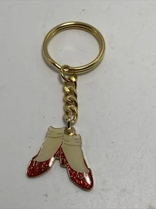 Llavero esmaltado de rubí Wizard of Oz tono dorado B5B - Imagen 1 de 7