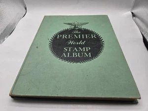 Album de timbres Le Premier Monde avec quelques timbres - Photo 1/8