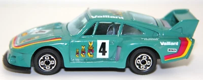 BURAGO USATO 1:43 AUTO DIE CAST PORSCHE 935 TT TURCHESE ART PRO 2 VARIE - Immagine 1 di 4