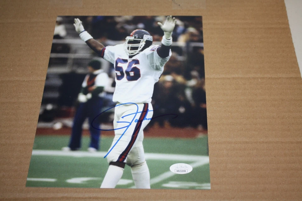 NEW YORK GIANTS LAWRENCE TAYLOR #56 SIGNED 8x10 PHOTO HOF 1999 AWAY POSE JSA - Image 1 of 1