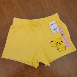 Pantaloncini corti gialli Pokemon Pickachu per bambina con tasche, taglia S (6-6X), nuovi - Foto 1 di 3