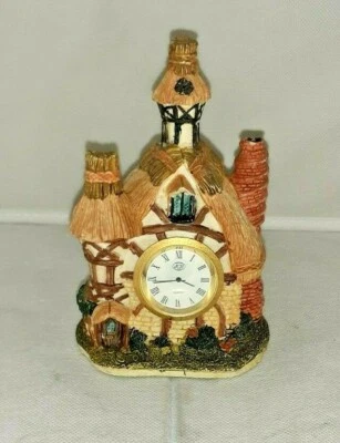 COLLECTIBLE RESIN COTTAGE HOME WITH A QUARTZ CLOCK - Image 1 of 4