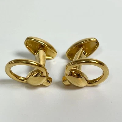  Gemelos Gucci con motivo de mordida de caballo en metal dorado forma redonda accesorio para hombre Italia Foto 1 de 4