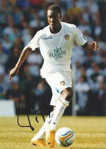 LEEDS UNITED: LLOYD SAM SIGNED 7x5 ACTION PHOTO+COA - Picture 1 of 1