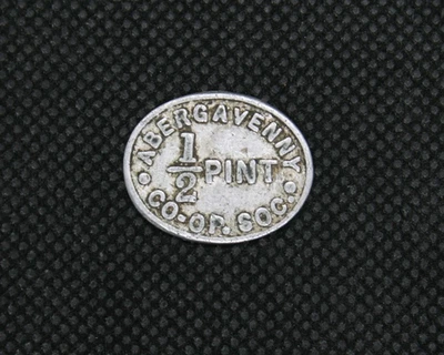 Old Vintage Oval Silver Coloured Abergavenny 1/2 PINT MILK token from CO-OP - Image 1 of 4