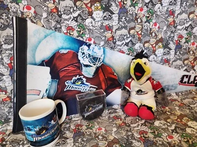 Lote de hockey Cleveland Lake Erie Monsters - Águila de peluche, disco, taza y banderín Foto 1 de 4