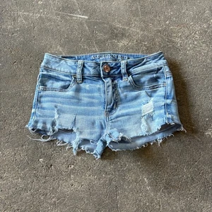 American Eagle Denim Jean Cut Off Shorts Size 0 Blue Distressed 2" Waist 25 - Picture 1 of 7