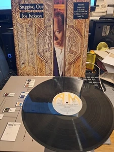 JOE JACKSON STEPPING OUT THE VERY BEST OF VG+/EX A&M VINYL LP RECORD 13 HITS - Picture 1 of 4