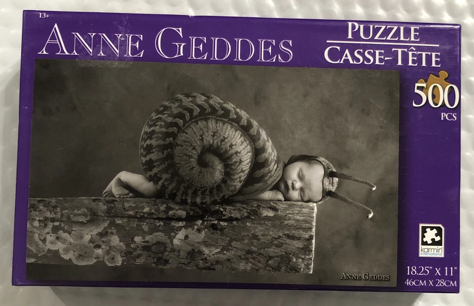 Rompecabezas ANNE GEDDES 500 piezas caracol bebé blanco y negro insecto guardería Foto 1 de 2