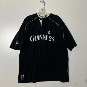 Maglia Rugby Vintage GUINNESS Merchandise Ufficiale Nera Manica Corta Uomo Taglia XL - Foto 1 di 8
