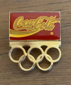 The Coca-Cola Company Coke Olympic Rings Gold Tone Lapel Pin 36 USC 380 HO HO - Picture 1 of 4